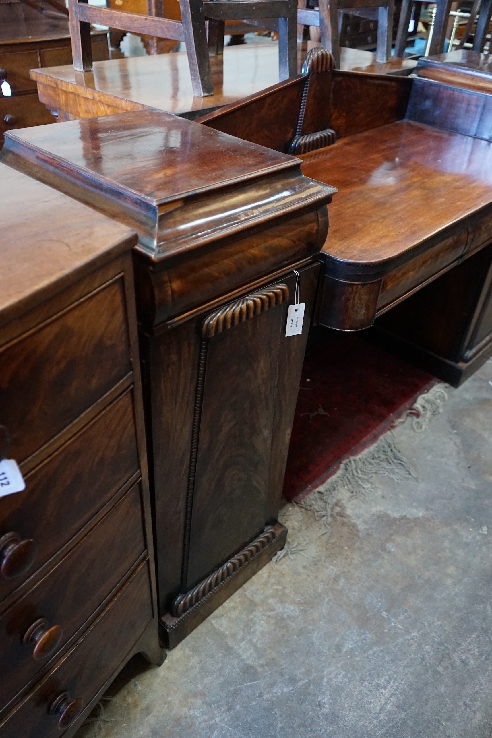 A Regency carved mahogany pedestal sideboard, length 186cm, depth 54cm, height 115cm